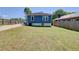 Expansive backyard with green grass, secure fencing, and plenty of room for entertainment and recreation at 1497 Rogers Sw Ave, Atlanta, GA 30310