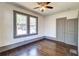 Inviting bedroom with hardwood floors, and two windows with natural light and closet at 1497 Rogers Sw Ave, Atlanta, GA 30310