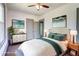 Bedroom featuring a ceiling fan, neutral tones, and decoratively coordinated furniture and artwork at 1497 Rogers Sw Ave, Atlanta, GA 30310