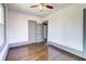 Spacious bedroom with hardwood floors, neutral walls, and access to closets and hallways at 1497 Rogers Sw Ave, Atlanta, GA 30310