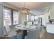 Bright kitchen featuring stainless steel appliances, white cabinetry, granite countertops, and hardwood floors at 1497 Rogers Sw Ave, Atlanta, GA 30310