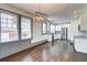 Bright kitchen featuring stainless steel appliances, white cabinetry, granite countertops, and hardwood floors at 1497 Rogers Sw Ave, Atlanta, GA 30310