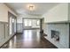 Living room featuring an open floor plan, fireplace, gray trim, and hardwood floors at 1497 Rogers Sw Ave, Atlanta, GA 30310