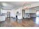 Open floor plan featuring a view into the kitchen with stainless steel appliances and fireplace at 1497 Rogers Sw Ave, Atlanta, GA 30310
