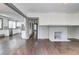 Spacious living room with hardwood floors, fireplace, and an open view to the kitchen for easy entertaining at 1497 Rogers Sw Ave, Atlanta, GA 30310