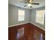 This bedroom features hardwood floors, neutral walls, and bright windows with blinds at 3426 Glenwood Rd, Decatur, GA 30032