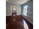 Open living room featuring wood floors and natural light at 3426 Glenwood Rd, Decatur, GA 30032