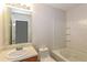 Cozy bathroom featuring a shower and bath, updated vanity and fixtures at 8409 Carlington Ln, Jonesboro, GA 30236
