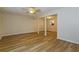 Bright, open living room with durable wood-look floors and neutral paint tones throughout at 8409 Carlington Ln, Jonesboro, GA 30236