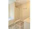 Bathroom with a shower, tub, sink, and modern neutral-toned flooring at 1172 Preserve Park Dr, Loganville, GA 30052