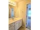 Bathroom with white vanity and large mirror at 1172 Preserve Park Dr, Loganville, GA 30052