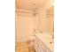 Clean bathroom with a shower, toilet, sink, and white cabinets for storage at 1172 Preserve Park Dr, Loganville, GA 30052