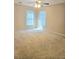 Bright bedroom with carpet, a ceiling fan, and two windows for natural light at 1172 Preserve Park Dr, Loganville, GA 30052