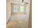 Carpeted bedroom with two windows and ceiling fan at 1172 Preserve Park Dr, Loganville, GA 30052