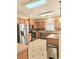Well-lit kitchen features stainless steel appliances and light wood cabinets at 1172 Preserve Park Dr, Loganville, GA 30052