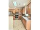 Well-equipped kitchen with wood cabinets, granite countertops, and stainless appliances at 1172 Preserve Park Dr, Loganville, GA 30052
