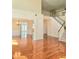 Spacious living room with hardwood floors and staircase at 1172 Preserve Park Dr, Loganville, GA 30052