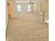 View of carpeted loft area with multiple windows and ceiling fan at 1172 Preserve Park Dr, Loganville, GA 30052