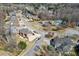 Aerial view of a suburban neighborhood featuring well-maintained homes and manicured lawns at 1540 Turtle Pond Dr, Hoschton, GA 30548