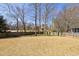 Fenced backyard with dormant grass at 1540 Turtle Pond Dr, Hoschton, GA 30548