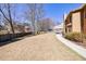 Large fenced backyard with trees and dormant grass at 1540 Turtle Pond Dr, Hoschton, GA 30548