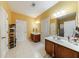 Bright bathroom featuring double sinks, tile flooring and walk-in shower at 1540 Turtle Pond Dr, Hoschton, GA 30548