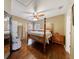 Bedroom with wood furniture, hardwood floors, and a ceiling fan at 1540 Turtle Pond Dr, Hoschton, GA 30548