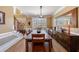 Elegant dining room features hardwood floors, custom mirror, and large windows at 1540 Turtle Pond Dr, Hoschton, GA 30548