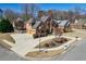 Stately brick home with a lush, landscaped front yard and a circular driveway in a desirable neighborhood at 1540 Turtle Pond Dr, Hoschton, GA 30548