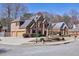Charming brick home on a corner lot with a well-maintained lawn, showcasing curb appeal and a spacious driveway at 1540 Turtle Pond Dr, Hoschton, GA 30548