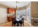 Cozy eat in kitchen nook with hardwood floors and lots of natural light at 1540 Turtle Pond Dr, Hoschton, GA 30548