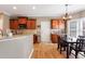 Kitchen nook with hardwood floors and stainless appliances at 1540 Turtle Pond Dr, Hoschton, GA 30548