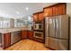 Open kitchen with stainless appliances and granite countertops at 1540 Turtle Pond Dr, Hoschton, GA 30548