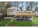 Multi-level deck and spacious backyard, ideal for outdoor entertaining and relaxation, with lush green grass at 7410 Fields Dr, Cumming, GA 30041