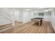 Spacious finished basement area with light wood floors featuring a billiard table and walkout access, perfect for recreation at 7410 Fields Dr, Cumming, GA 30041