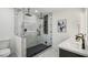 Modern bathroom featuring a large, glass-enclosed walk-in shower and white countertops at 7410 Fields Dr, Cumming, GA 30041