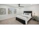 Comfortable bedroom featuring a plush bed, soft carpet, and a ceiling fan, offering a relaxing retreat at 7410 Fields Dr, Cumming, GA 30041