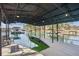 Spacious boat dock with metal roof, perfect for relaxing or entertaining while enjoying waterfront activities at 7410 Fields Dr, Cumming, GA 30041