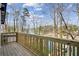 Wooden deck with views of the lake, trees and community at 7410 Fields Dr, Cumming, GA 30041