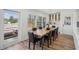 Dining area with access to the outdoor deck, features modern decor and ample seating at 7410 Fields Dr, Cumming, GA 30041