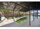 Lakeside dock boasts covered boat slip and built-in benches, ideal for soaking in the serene waterfront setting at 7410 Fields Dr, Cumming, GA 30041