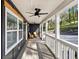 Inviting front porch with comfortable seating, offering a perfect spot to relax and enjoy the neighborhood views at 7410 Fields Dr, Cumming, GA 30041