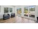 Cozy living room featuring hardwood floors and access to an outdoor deck area with views at 7410 Fields Dr, Cumming, GA 30041