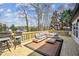Relax on the spacious deck with comfortable seating and picturesque views, perfect for outdoor enjoyment at 7410 Fields Dr, Cumming, GA 30041