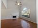 Bright living room features a fireplace, large windows, vaulted ceilings, and hardwood floors at 781 Soaring Dr, Marietta, GA 30062