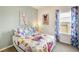 Cozy bedroom featuring colorful decor, comfortable bed, and ample natural light at 112 Asher Dr, Carrollton, GA 30116