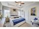 Luxurious main bedroom featuring a tray ceiling, elegant furnishings, and plenty of natural light at 112 Asher Dr, Carrollton, GA 30116
