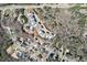 Aerial view of the neighborhood with houses, tree lined streets, and verdant areas at 1775 Rockwater Rd, Marietta, GA 30066