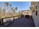 Spacious wooden deck with outdoor seating overlooking a wooded backyard and play set at 1775 Rockwater Rd, Marietta, GA 30066