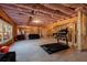 Unfinished basement with a treadmill and ample open space, offering potential for various recreational activities at 1775 Rockwater Rd, Marietta, GA 30066